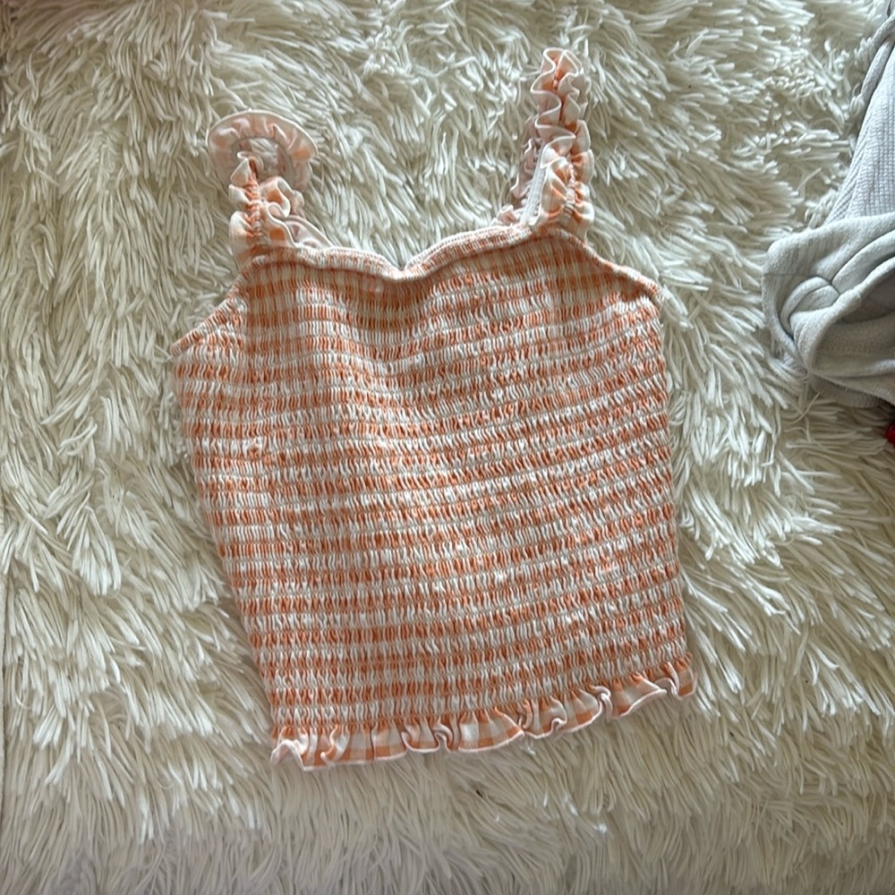 Orange and white checkered top